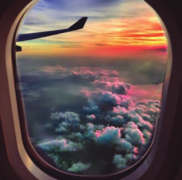 Sunset and clouds seen from an aircraft window